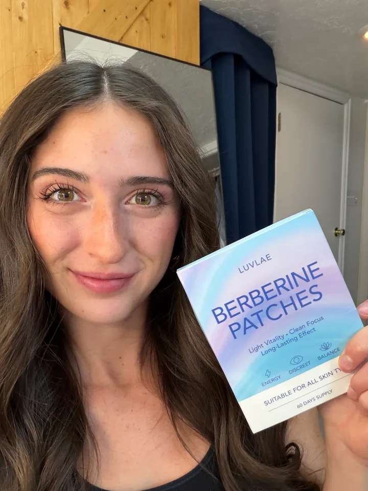 Woman holding a Luvlae Berberine Patches box indoors